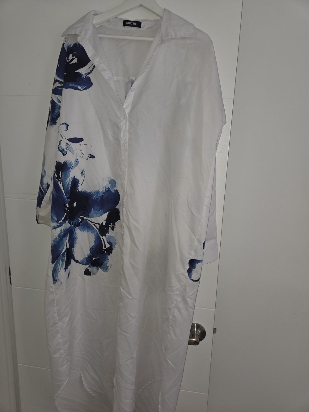 chic White Maxi Dress with Navy Blue Floral Accents